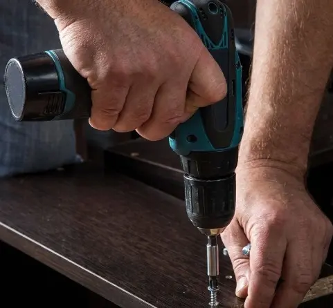 Assorted drill bits and fixings on a workbench